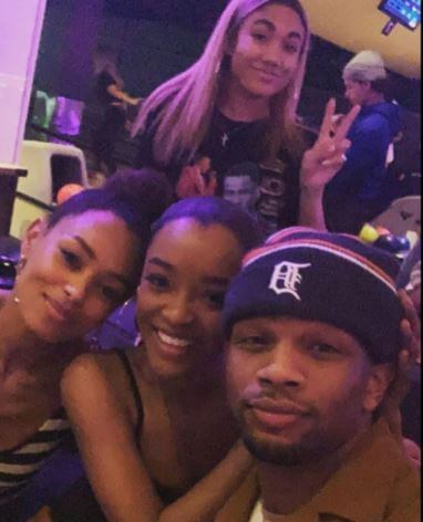 Daniel Bellomy with his girlfriends.